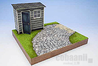 小屋と石畳のある庭